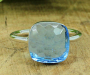 Elegant 12mm blue topaz stackable ring crafted in sterling silver, radiating calm and timeless style